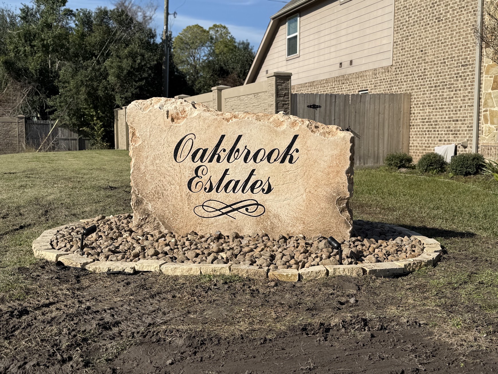 Custom commercial sign made of engineered stone in Houston by Bedrock Boulders.