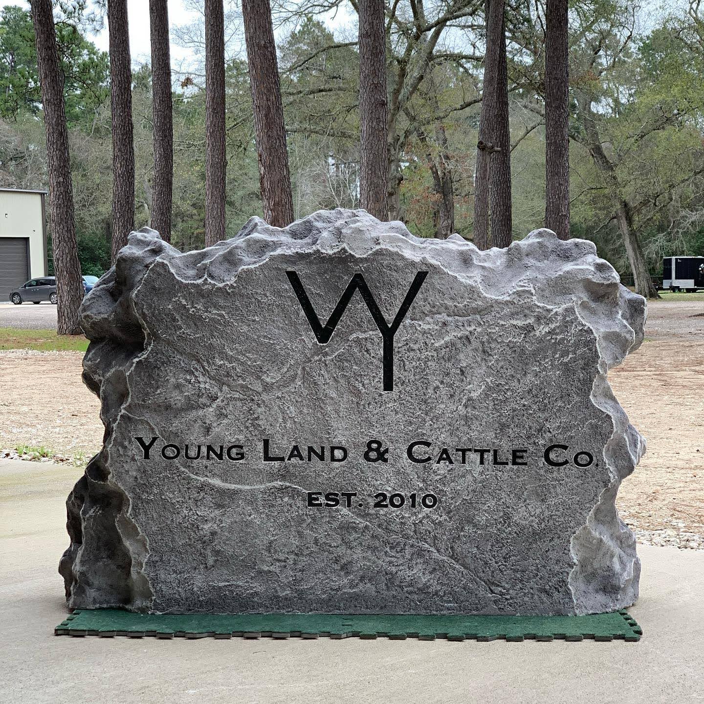 Custom commercial sign made of engineered stone in Houston by Bedrock Boulders.