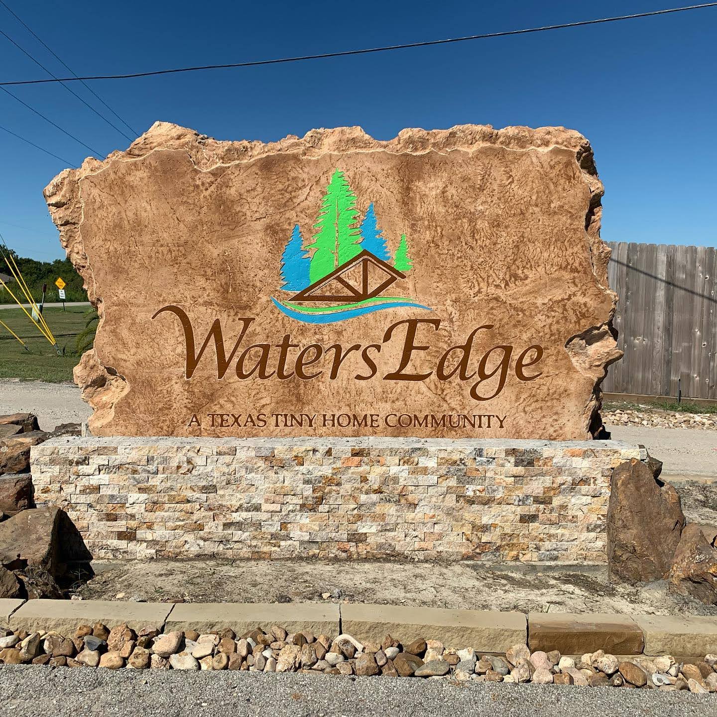 Custom commercial sign made of engineered stone in Houston by Bedrock Boulders.