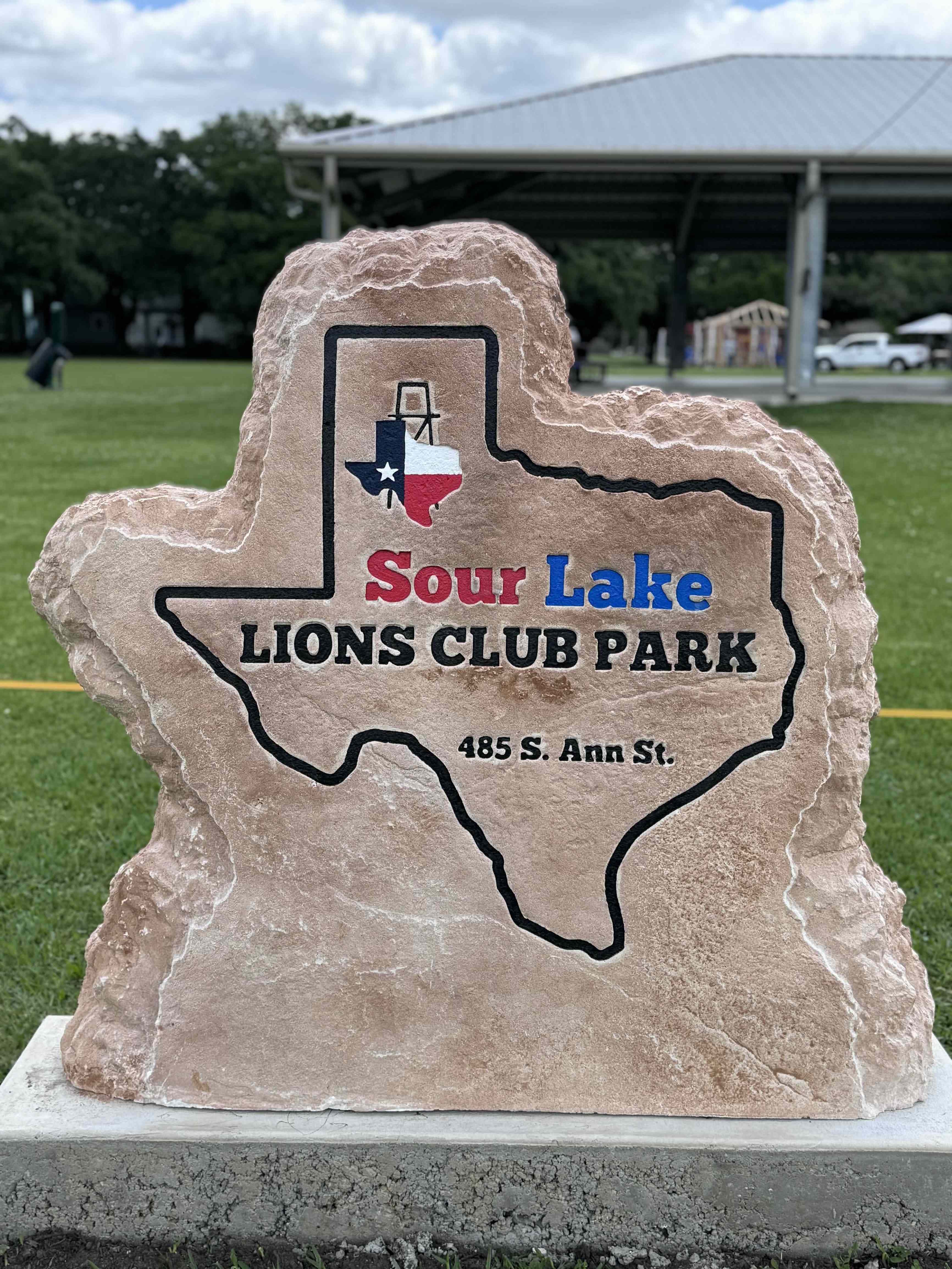 Custom commercial sign made of engineered stone in Houston by Bedrock Boulders.