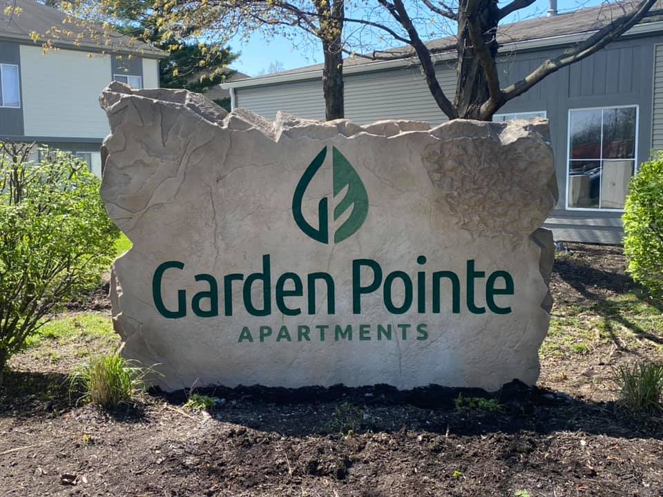 Custom commercial sign made of engineered stone in Houston by Bedrock Boulders.