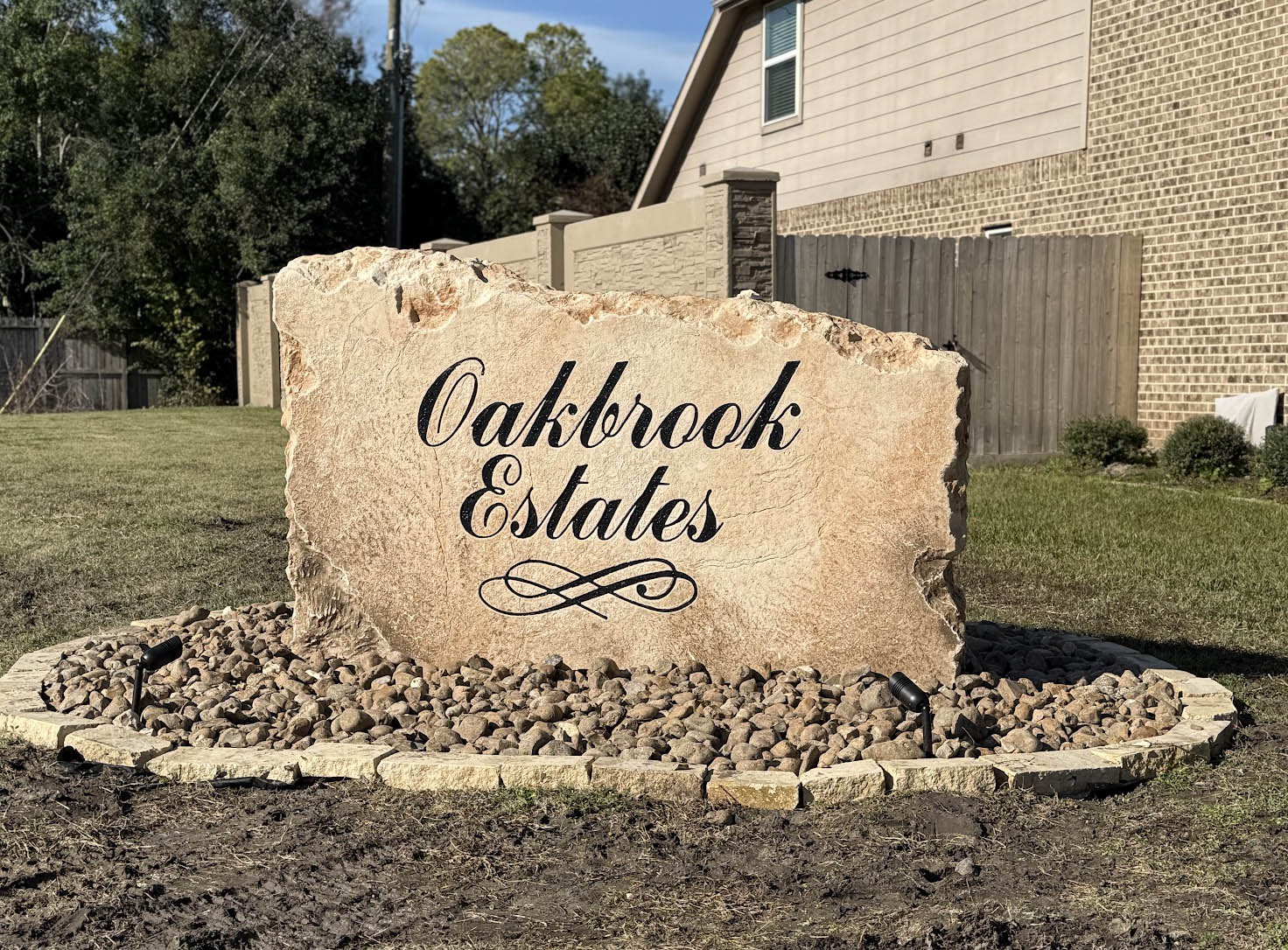 Custom commercial sign made of engineered stone in Houston by Bedrock Boulders