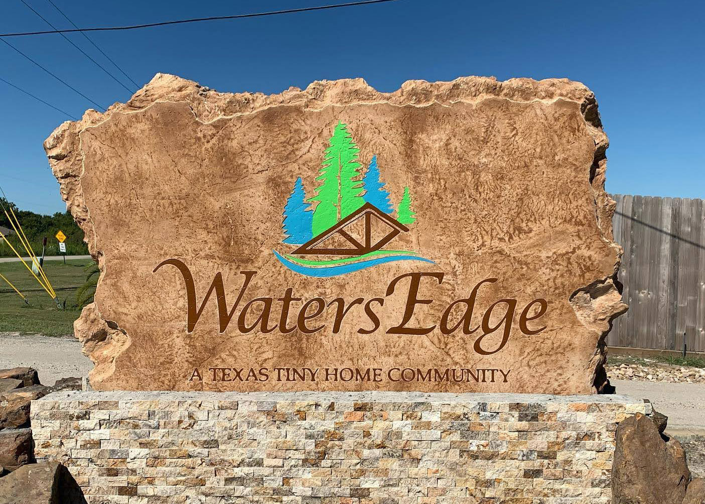 Custom commercial sign made of engineered stone in Houston by Bedrock Boulders