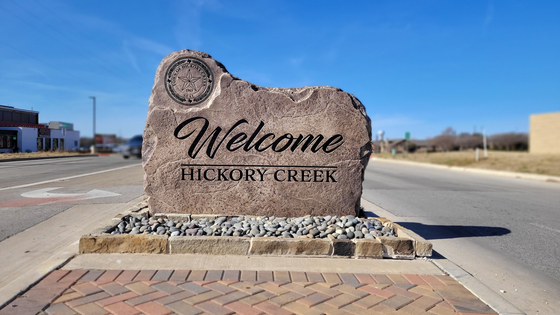 Custom commercial sign made of engineered stone in Houston by Bedrock Boulders