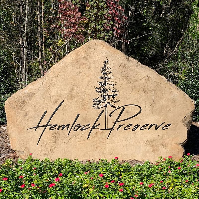 Custom commercial sign made of engineered stone in Houston by Bedrock Boulders