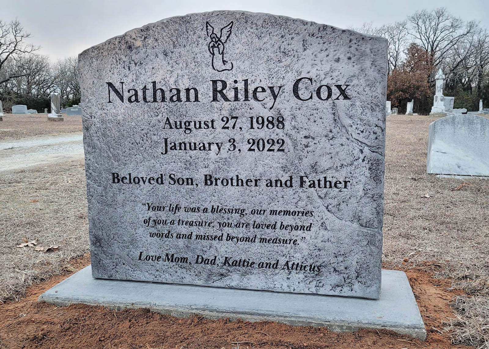 Custom headstone made of engineered stone in Houston by Bedrock Boulders