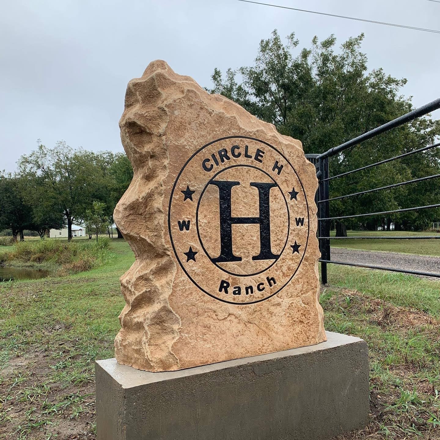 Custom ranch sign made of engineered stone in Houston by Bedrock Boulders.