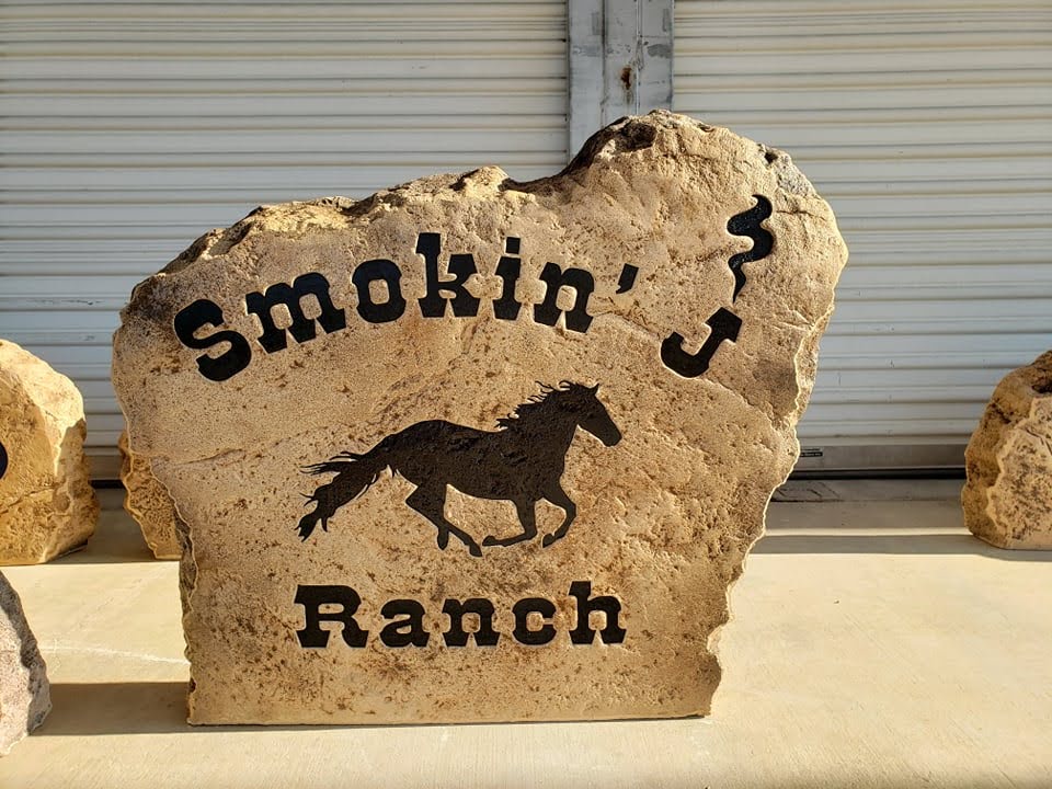 Custom ranch sign made of engineered stone in Houston by Bedrock Boulders.