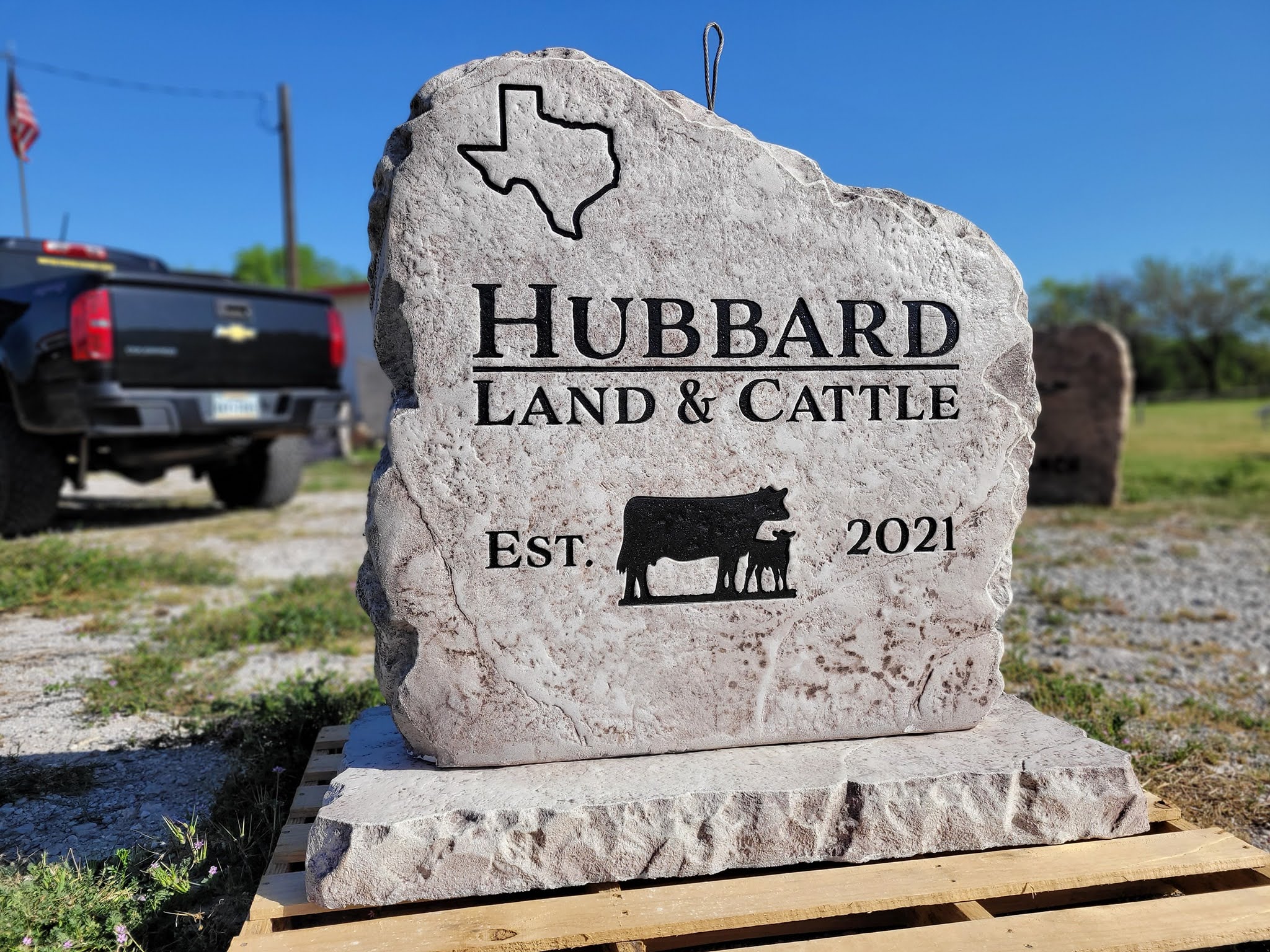 Custom ranch sign made of engineered stone in Houston by Bedrock Boulders.